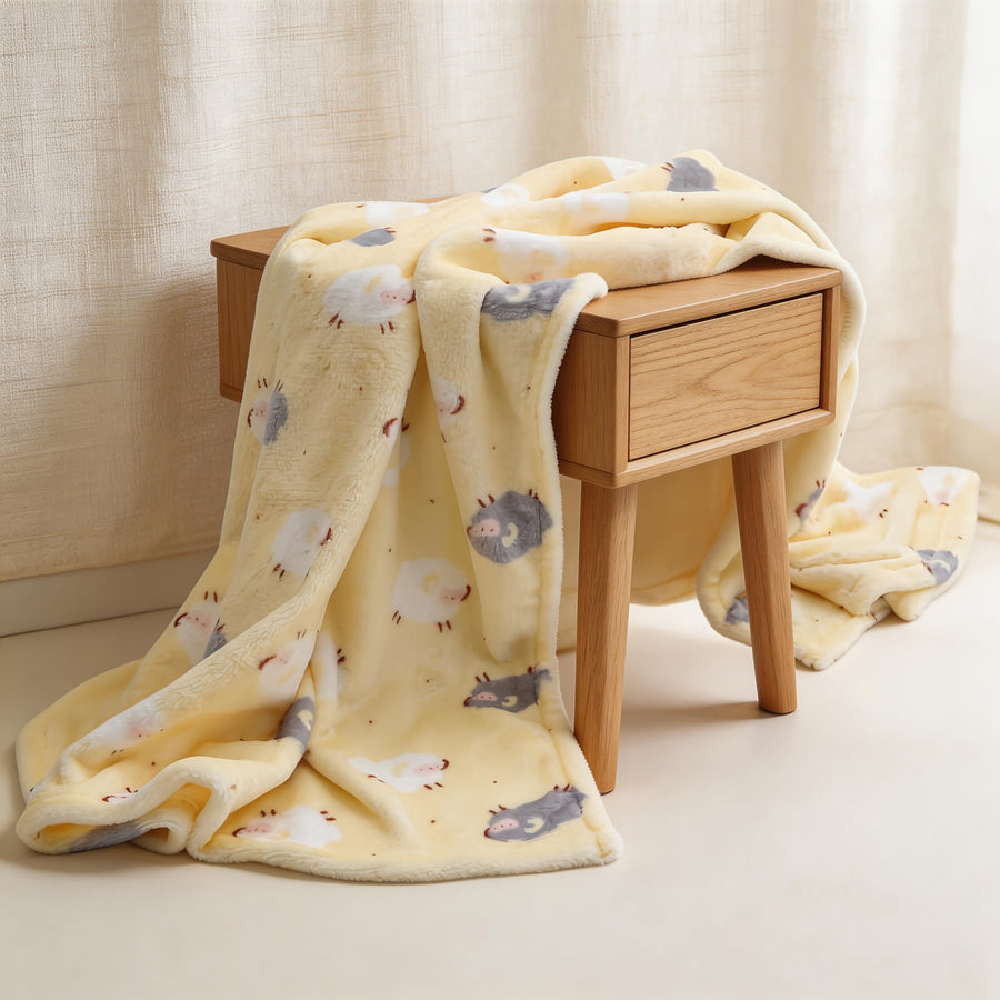 Une couverture à motif de mouton adaptée à toutes les saisons — Monptitlou